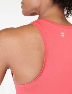 Sweaty Betty Athlete Crop Seamless Gym Vest - Coral Pink -Elevate Fitwear Sales Store sweaty betty athlete crop seamless gym vest coral pink sb6545c 3